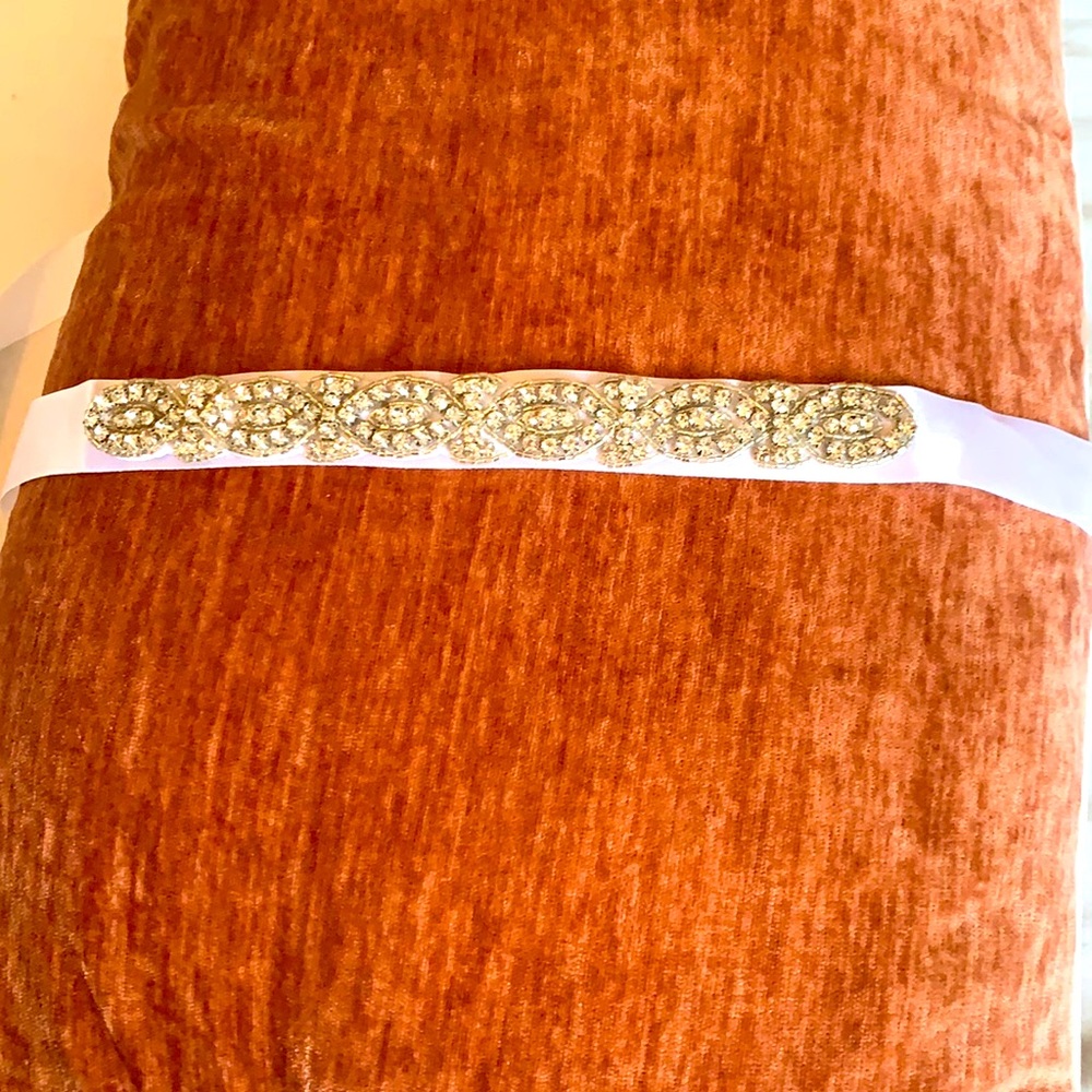 White sash with rhinestones